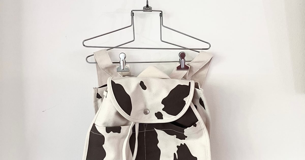 BAGGU Cow print drawstring backpack Used Noihsaf Bazaar