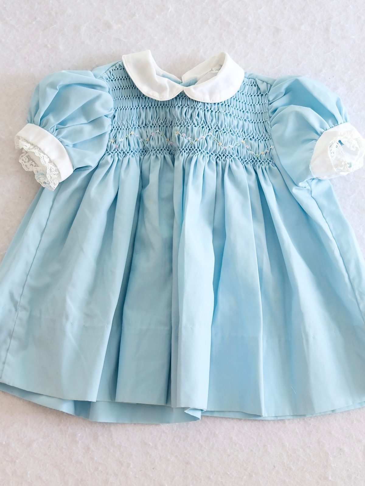 Polly Flinders Vintage Blue Hand Smocked Baby Dress | Noihsaf Bazaar Polly Flinders Vintage Blue Hand Smocked Baby Dress | Noihsaf Bazaar